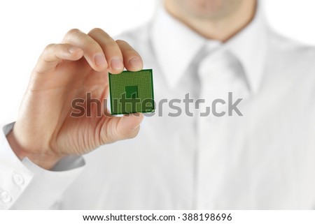 Man holding microprocessor in his hand on white background