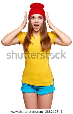 Surprised teen funky girl with opened mouth and hands on head