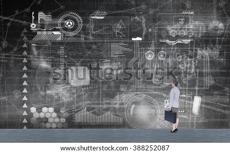 Businesswoman looking away against hologram background