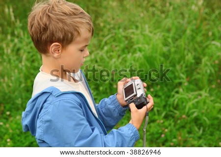 boy with photo camera outdoor