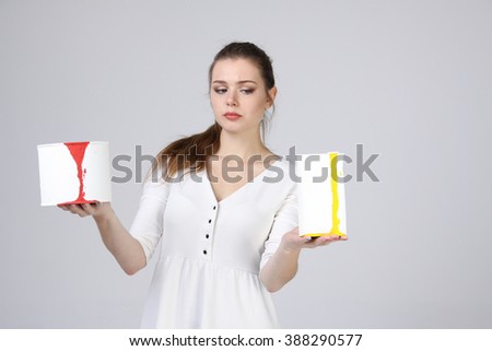 girl in white dress holding paint cans