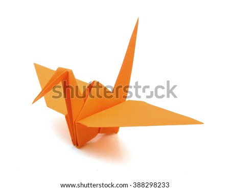 origami crane on white background  Royalty-Free Stock Photo #388298233