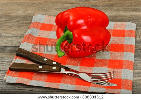 Fresh Red Bell Pepper on Wood Background. Studio Photo