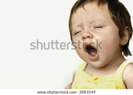 Yawning baby isolated on white
