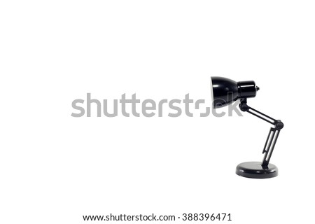 Black mini led desk lamp isolated on white background Royalty-Free Stock Photo #388396471