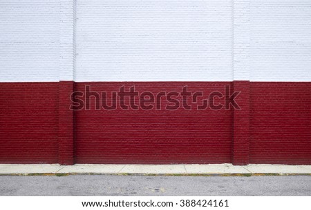 Painted on red brick wall on the street Royalty-Free Stock Photo #388424161