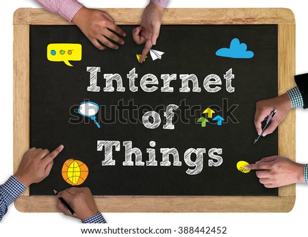 vintage blackboard with wooden frame isolated on white background. chalkboard with business man hand working and internet of things (IoT) word 3 concept