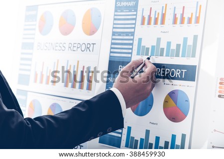 Businessman analyzing investment charts. Accounting Royalty-Free Stock Photo #388459930