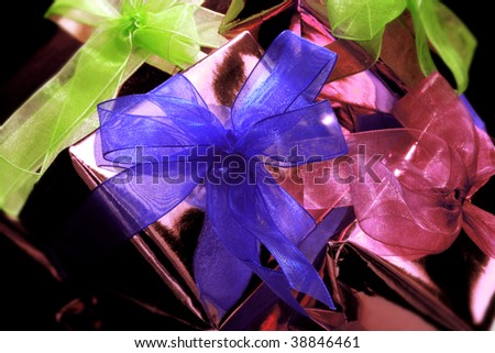 background image of pink color giftboxes with colorful ribbons