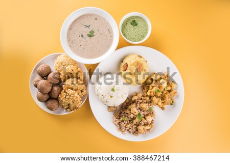 Indian Fasting Recipes or Upwas Food, for Navratri , Maha Shivratri / Ekadasi / Chaturthi or Gauri vrat. Served in ceramic crockery over colourful or wooden background. Selective focus Royalty-Free Stock Photo #388467214