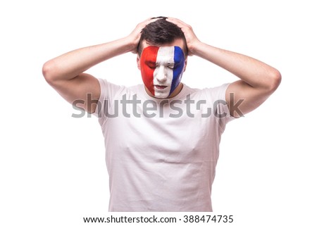 France football fan disappointed  of score of the game or lose  game of France national football team. Disappointed emotion, hands over head  on white background. European  football fans concept.