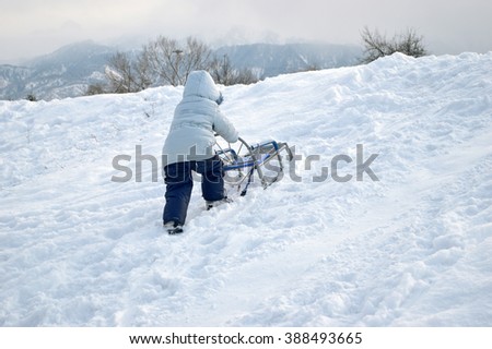 Winter fun girl up the hill to sledding