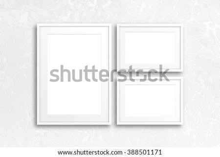 Blank photo frames mockup on modern textured wallpaper