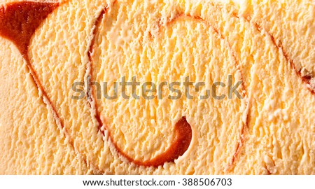 Horizontal close up of delicious creamy caramel flavor ice cream with spiral shapes inside