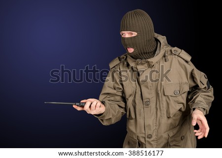 Dangerous criminal holding a knife