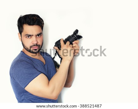Young indian Photographer with camera