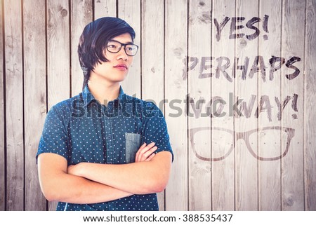 Thought hipster businessman looking away against wooden planks
