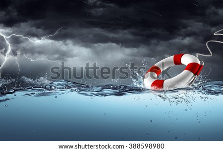 Sos - Lifebelt In Tempest For Help Concept Royalty-Free Stock Photo #388598980