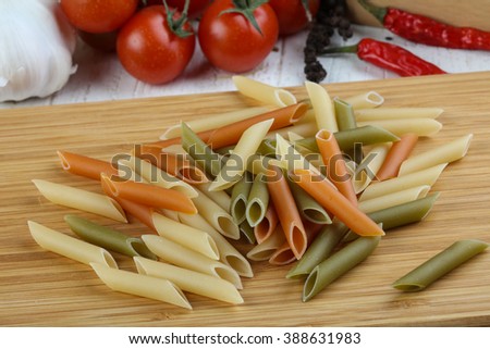 Raw color penne pasta - ready for cooking