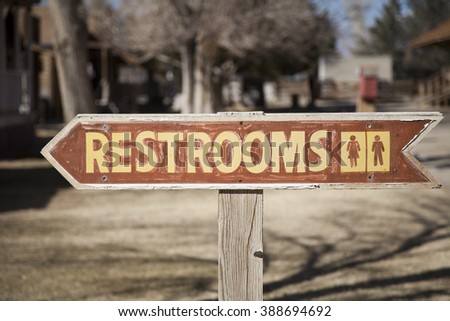 Brown restrooms sign