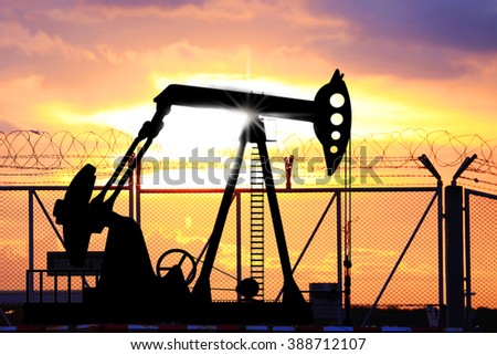 The petroleum oil pump in sunset sky