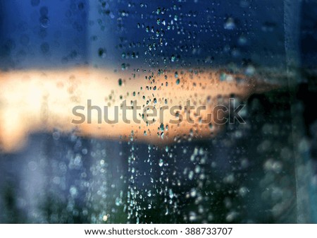 Raindrops on glass abstract background
