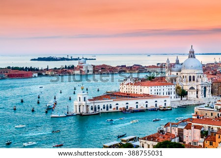 Panoramic aerial cityscape of Venice and Grand Canal with Santa Maria della Salute church at sunset, view from Campanile di San Marco to Venetian Lagoon, Italy Royalty-Free Stock Photo #388755031