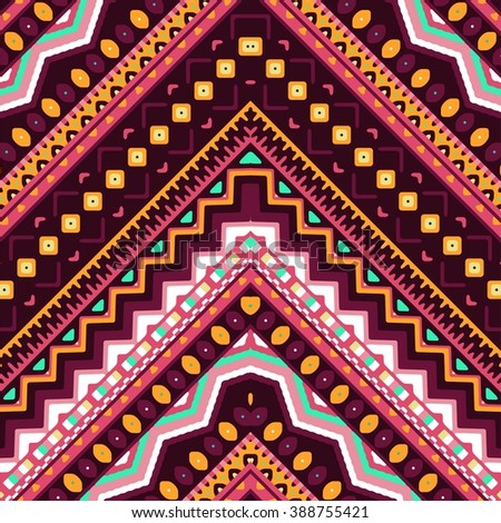 Seamless hand drawn chevron pattern with aztec ethnic and tribal ornament. Vector dark and bright colors boho fashion illustration.