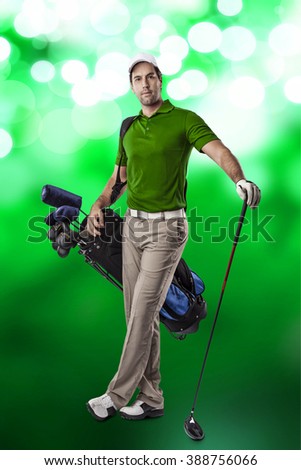 Golf Player in a green shirt, standing with a bag of golf clubs on his back, on a green lights Background.