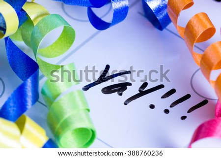 concept image for celebrating life using a dry erase calendar and curly ribbon