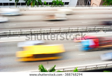 Truck and cars  on a highway in Singapore. Motion blur