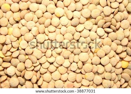Pile of dried lentils as a background.