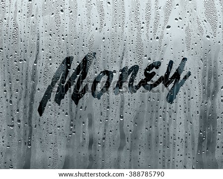 Money written on a foggy window