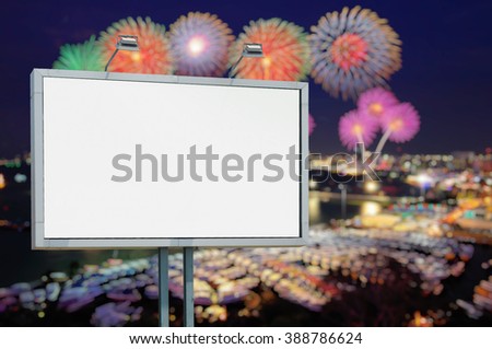 Blank billboard at cityscape with fireworks, put your own text here