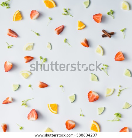 Colorful pattern made of citrus fruits, leaves and strawberries. Royalty-Free Stock Photo #388804207