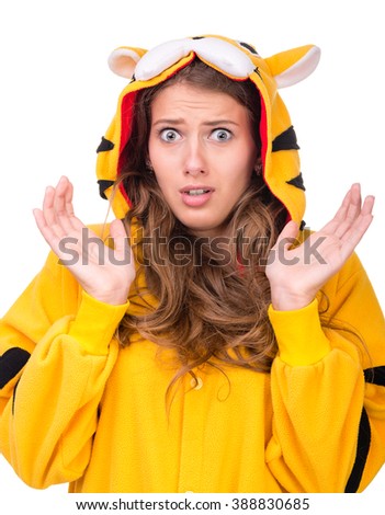 portrait of scared young woman in the tiger costume isolated on white studio shot