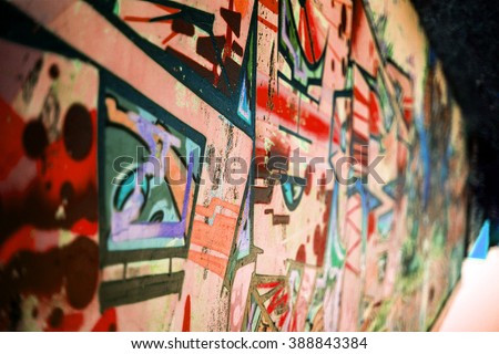 Beautiful street art of graffiti. Abstract color creative drawing fashion on  walls of city. Urban contemporary culture. The original dot pattern with selective focus in future. Creative design option