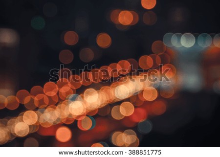 Defocused abstract bokeh lights on road in the city