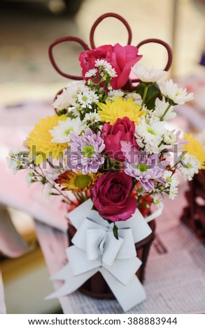 Gift of Beautiful flower decoration on nature background. handbasket of flowers in pastel styles.selective focus.