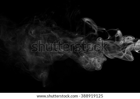movement of smoke white on black background ink beautiful b w