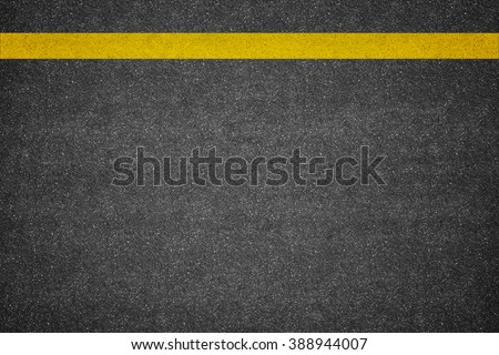 Asphalt road background with yellow line Royalty-Free Stock Photo #388944007
