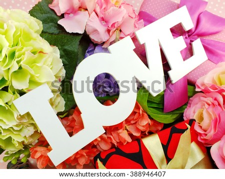 text love word copy with gift and flower close up
