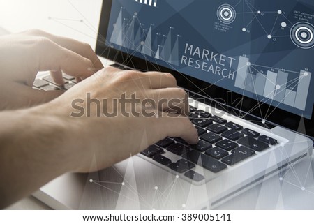 technology and business concept: man using a laptop with market research software on the screen. All screen graphics are made up.