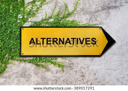 Alternatives on yellow sign hanging on ivy wall