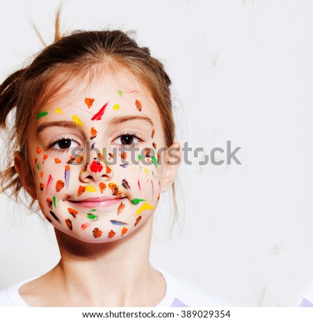 Funny little girl with colored face