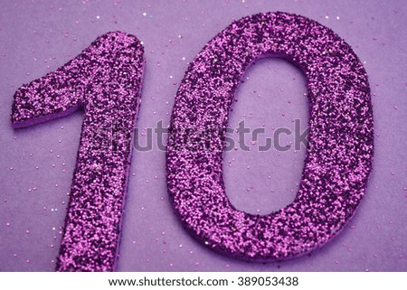 Number ten purple color over a purple background. Anniversary. Horizontal