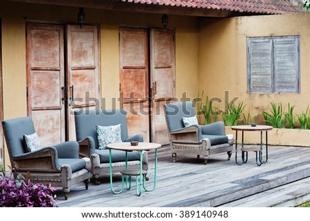 Outdoor patio seating with nice bench chairs at sunset