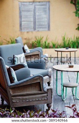 Outdoor patio seating with nice bench chairs at sunset