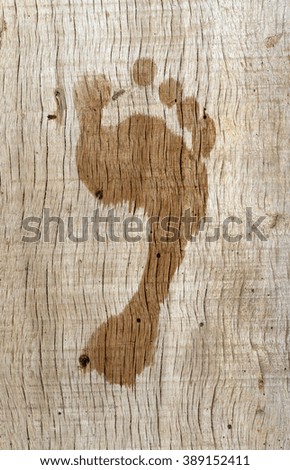  footprint on wood background