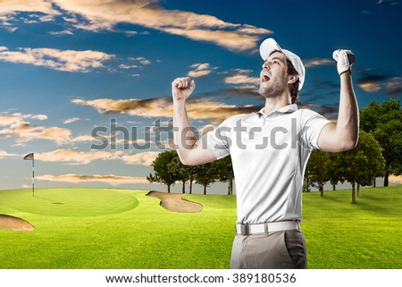 Golf Player in a white shirt celebrating, on a golf course.